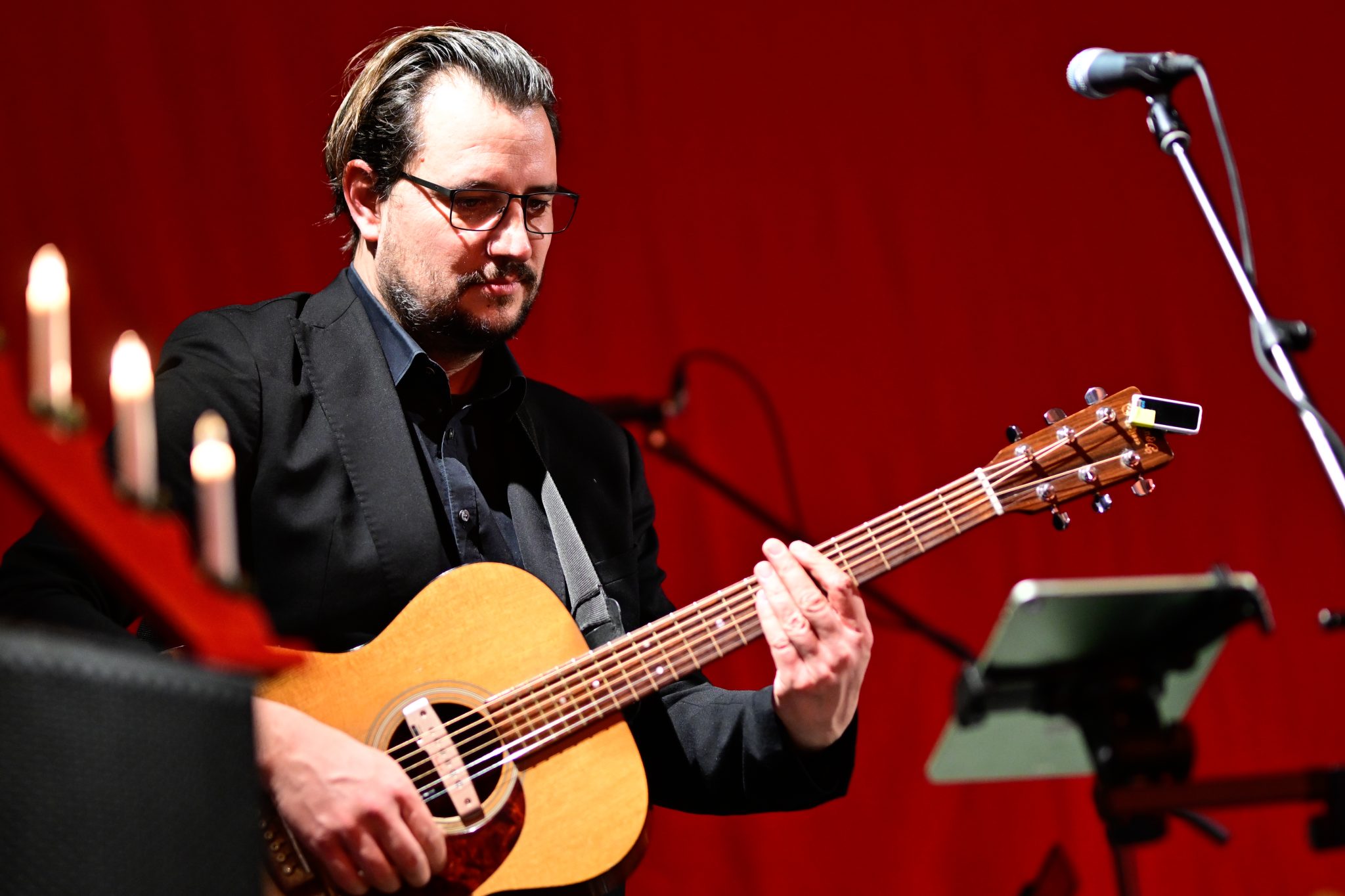 Michael Strobel performing with acoustic guitar